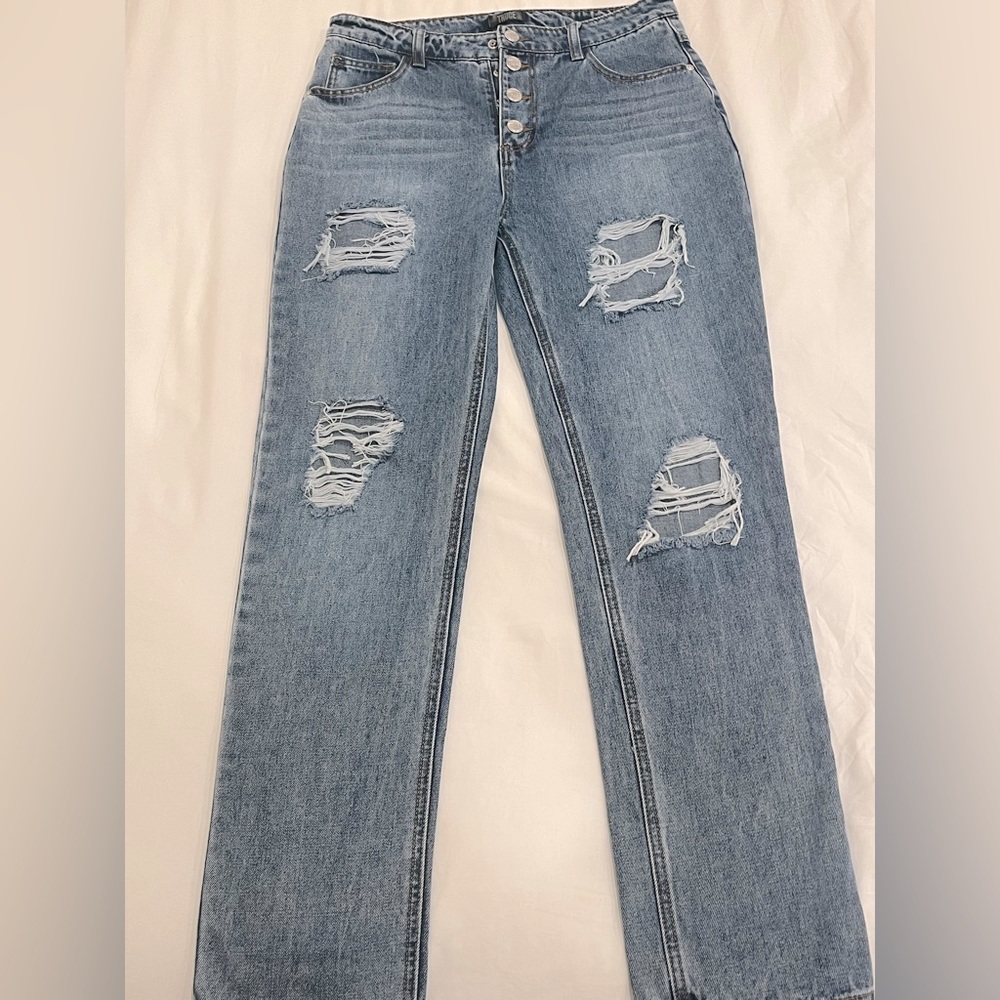 Distressed denim jeans